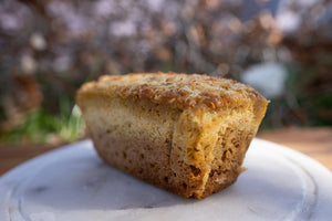 Lemon Cake on a white plate with a blurred natural background